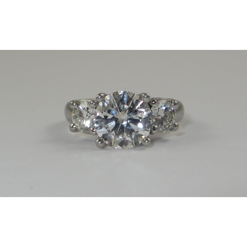 78 - A platinum three stone diamond ring