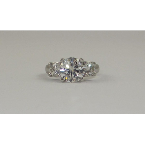 78 - A platinum three stone diamond ring