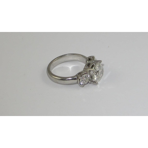 78 - A platinum three stone diamond ring