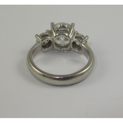 78 - A platinum three stone diamond ring