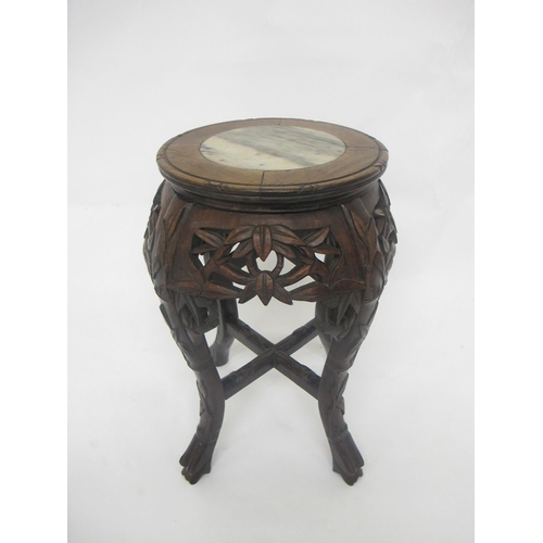 793 - A Chinese carved occasional table