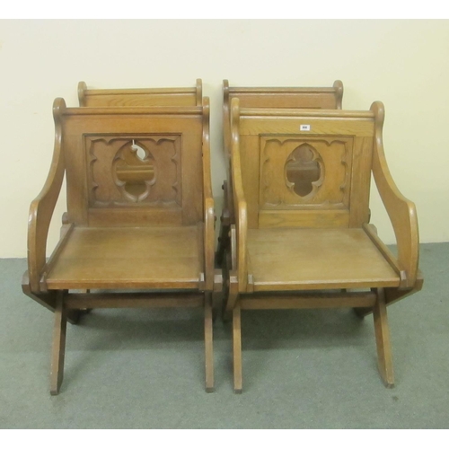 808 - Four matching Gothic Revival carved oak church armchairs