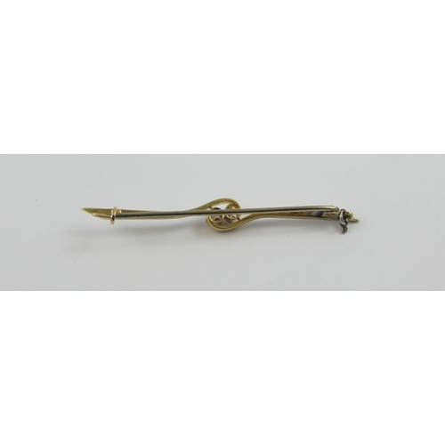 102 - A 18ct yellow and white metal bar brooch set with two diamonds in a twist design. Approx weight 3.1g... 