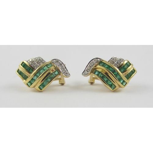 108 - A pair of 14ct yellow gold earrings set with diamonds and emeralds. The square cut emeralds are chan... 