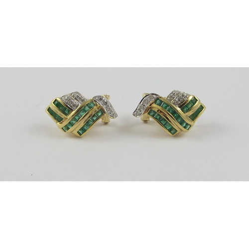 108 - A pair of 14ct yellow gold earrings set with diamonds and emeralds. The square cut emeralds are chan... 