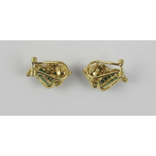 108 - A pair of 14ct yellow gold earrings set with diamonds and emeralds. The square cut emeralds are chan... 