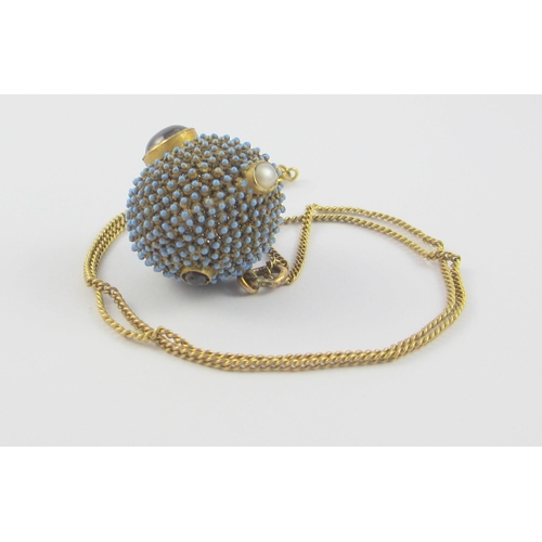 110 - An interesting yellow metal bead pendant