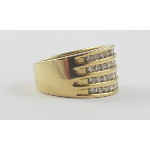 112 - A 10ct yellow gold ring set with forty four channel set brilliant cut diamonds. Ring size N 1/2.