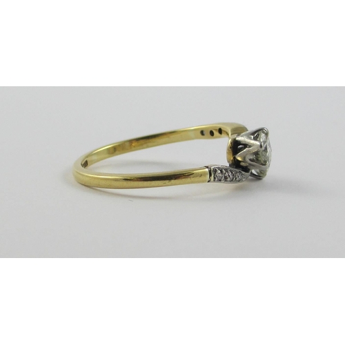 122 - A two stone diamond twist  ring of approx 0.60cts  set in 18ct yellow and white metal  with pave set... 