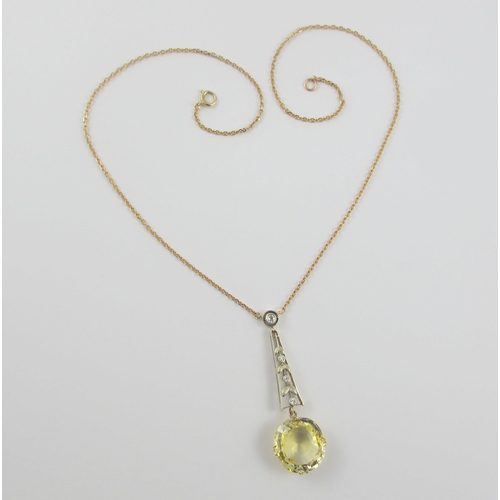 126 - A Edwardian citrine and diamond pendant  in 9ct yellow gold and white metal  the beautiful large cut... 