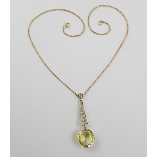 126 - A Edwardian citrine and diamond pendant  in 9ct yellow gold and white metal  the beautiful large cut... 