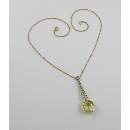 126 - A Edwardian citrine and diamond pendant  in 9ct yellow gold and white metal  the beautiful large cut... 