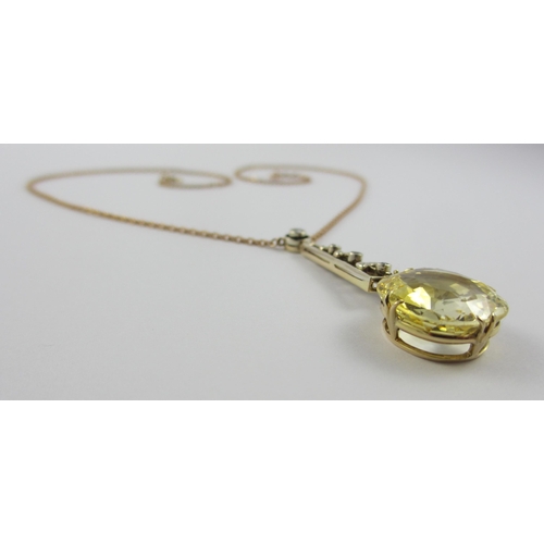 126 - A Edwardian citrine and diamond pendant  in 9ct yellow gold and white metal  the beautiful large cut... 