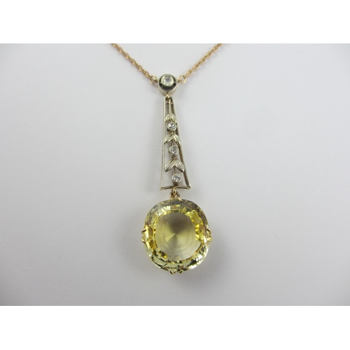 126 - A Edwardian citrine and diamond pendant  in 9ct yellow gold and white metal  the beautiful large cut... 