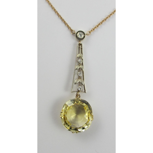 126 - A Edwardian citrine and diamond pendant  in 9ct yellow gold and white metal  the beautiful large cut... 