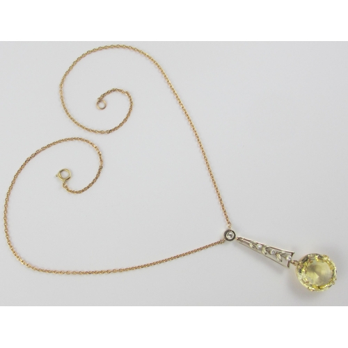 126 - A Edwardian citrine and diamond pendant  in 9ct yellow gold and white metal  the beautiful large cut... 