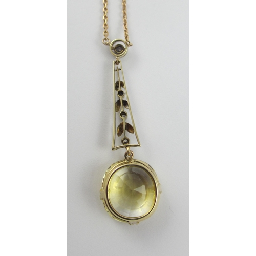 126 - A Edwardian citrine and diamond pendant  in 9ct yellow gold and white metal  the beautiful large cut... 