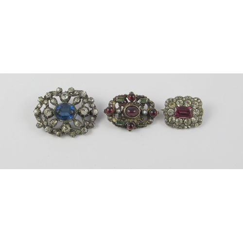 128 - An Austro-Hungarian brooch in gilded white metal  set with garnets  pearls and emeralds  together wi... 