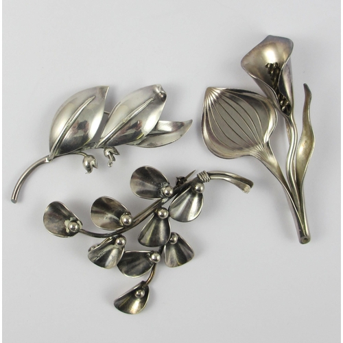 133 - Three Danish design brooches  two floral brooches by Anton Michelsen  and a further floral brooch by... 