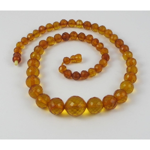 134 - A string of Faceted amber beads  ranging in size from largest approx 16mm to smallest approx 6.7mm  ... 