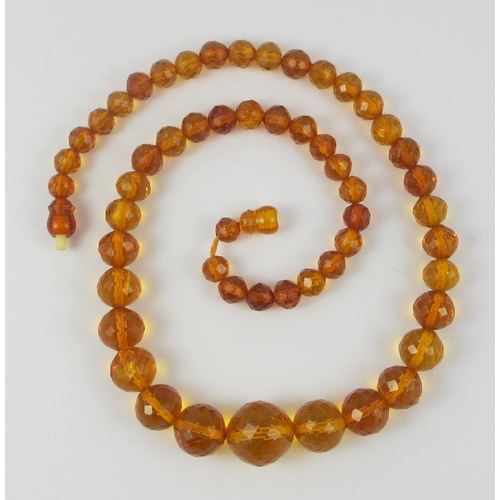 134 - A string of Faceted amber beads  ranging in size from largest approx 16mm to smallest approx 6.7mm  ... 