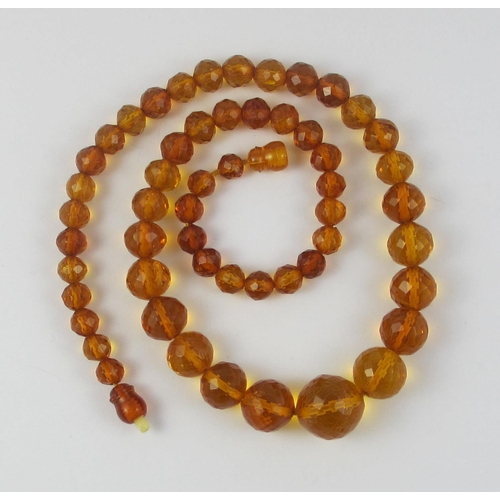 134 - A string of Faceted amber beads  ranging in size from largest approx 16mm to smallest approx 6.7mm  ... 