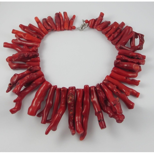 135 - A dyed red coral fringe necklace  approx length of longest bead is 8cm and the shortest 3.5cm  total... 
