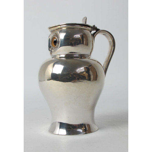 148 - A novelty silver jug