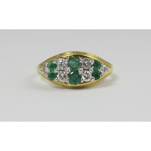 65 - An 18ct yellow gold emerald and diamond cluster ring  the six emeralds and six diamonds are claw set... 