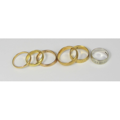 73 - A collection of seven wedding bands to include  a 18ct yellow gold wedding band bearing the Glasgow ... 