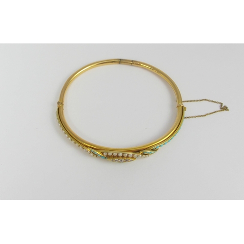 75 - A yellow metal bangle set with diamonds  seed pearls and turquoise. Weight approx 9.6gms