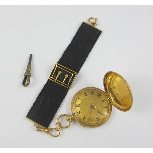 79 - an 18ct yellow gold cased fob watch by Mottu Geneve  the case extensively engraved with flowers and ... 