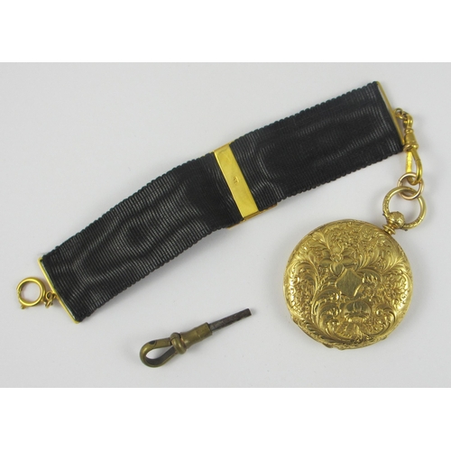 79 - an 18ct yellow gold cased fob watch by Mottu Geneve  the case extensively engraved with flowers and ... 