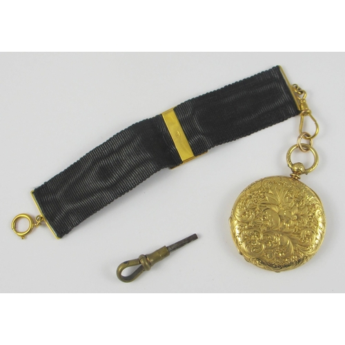 79 - an 18ct yellow gold cased fob watch by Mottu Geneve  the case extensively engraved with flowers and ... 