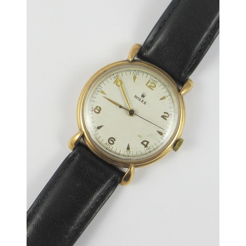 80 - A 9ct cased 'Rolex' watch. Serial numbers on the case 4516 364  on good leather strap.