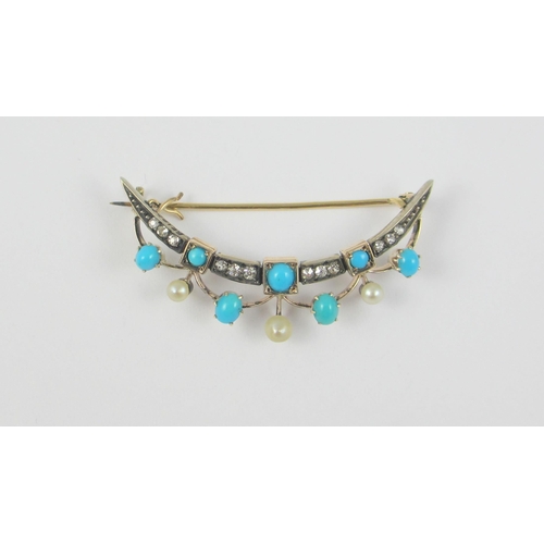 82 - A Crescent moon brooch set with diamonds pearls and turquoise  mounted in yellow and white metal.