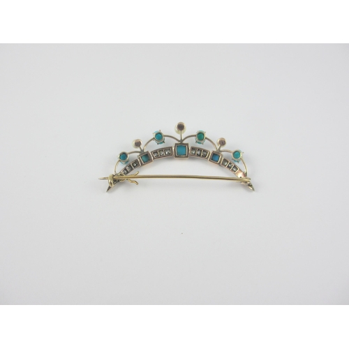 82 - A Crescent moon brooch set with diamonds pearls and turquoise  mounted in yellow and white metal.