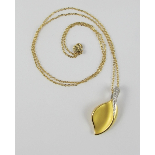 84 - A diamond set 18ct yellow leaf design pendant on a chain. Approx 3.3gms