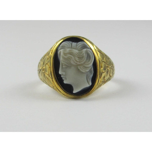 86 - A 14ct yellow gold gentleman's ring set with a hardstone intaglio of a ladies head in profile  the s... 