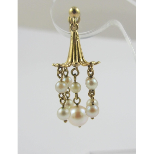 92 - A pair of 9ct yellow gold fushia flower shaped earrings  hung with five drops of pearls  together wi... 