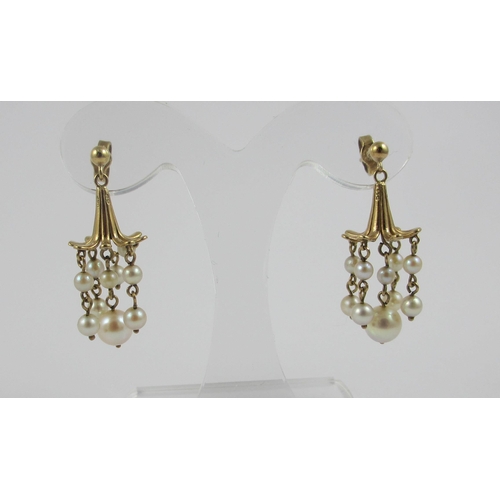 92 - A pair of 9ct yellow gold fushia flower shaped earrings  hung with five drops of pearls  together wi... 