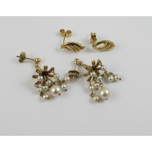 92 - A pair of 9ct yellow gold fushia flower shaped earrings  hung with five drops of pearls  together wi... 