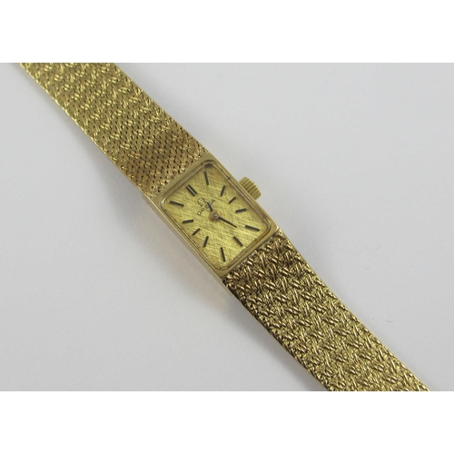 94 - a 9ct ladies wristwatch with integral 9ct woven strap. Approx weight 24.7gms.