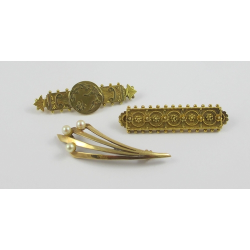 98 - A collection of three gold and yellow metal brooches  A 9ct classical revival example with a butterf... 