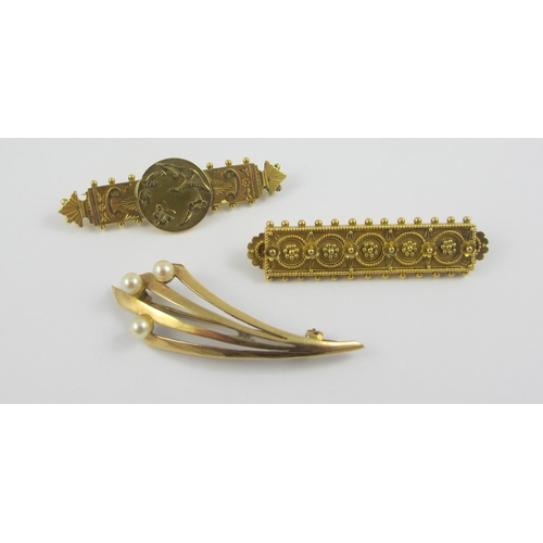 98 - A collection of three gold and yellow metal brooches  A 9ct classical revival example with a butterf... 