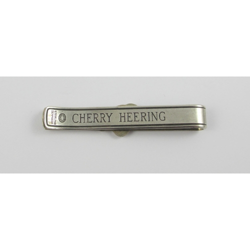 99 - A 'Georg Jensen' Cherry Heering tie clip. With the Georg Jensen stamp and sterling Denmark.