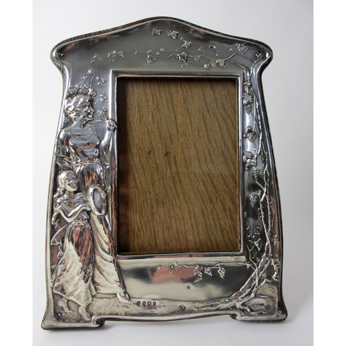 165 - An Art Nouveau silver mounted photograph frame