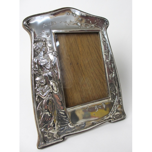 165 - An Art Nouveau silver mounted photograph frame