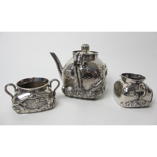 193 - A three piece Chinese silver tea service