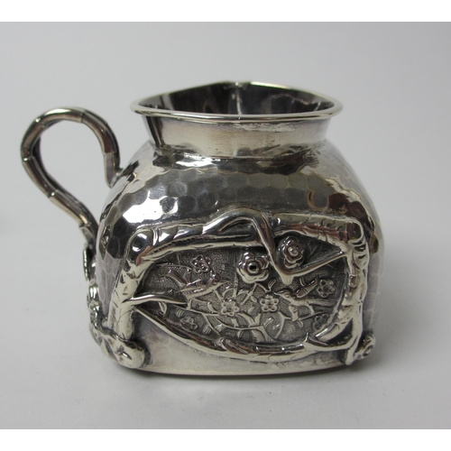 193 - A three piece Chinese silver tea service